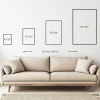 a couch with sizes and measurements on the wall